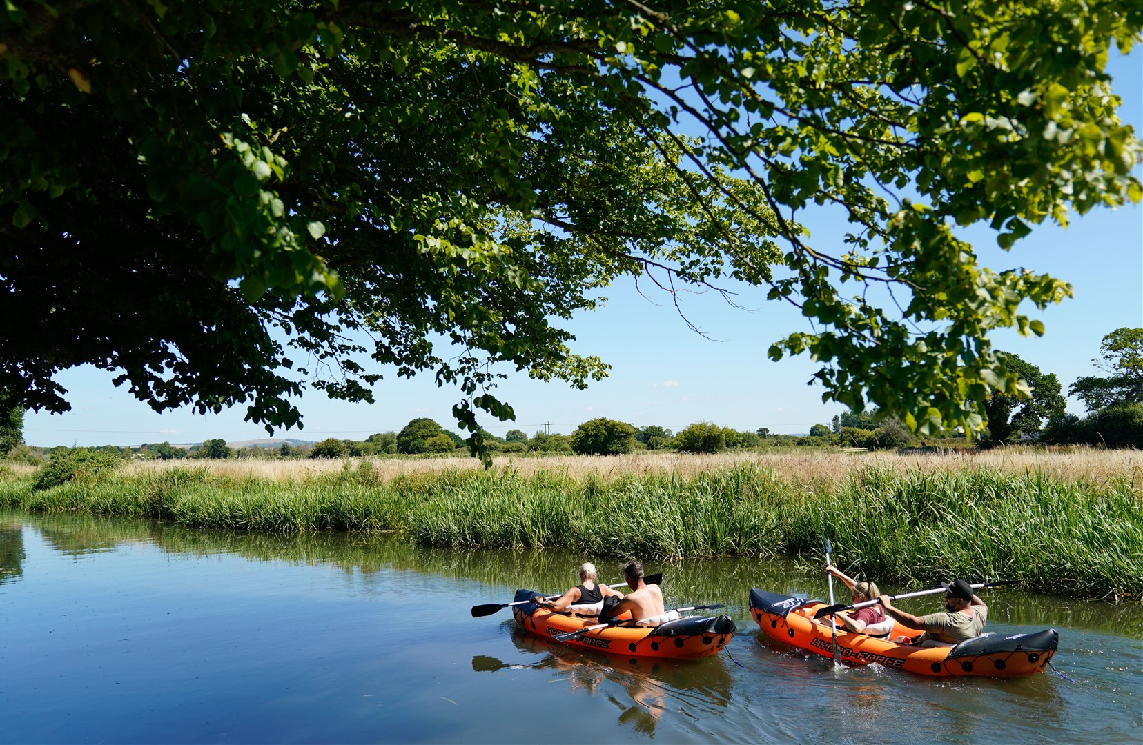 People canoe along the Chichester Canal near Hunston in West Sussex (Andrew Matthews/PA)