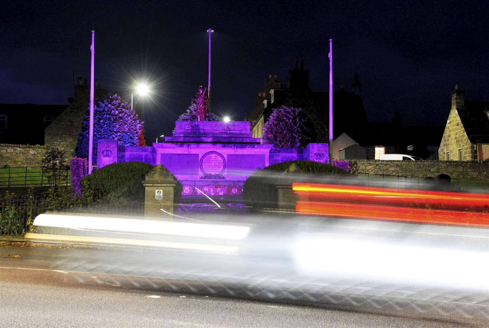 Car lights add to the colour at the of Keith War Memorial. Picture: Eric Cormack