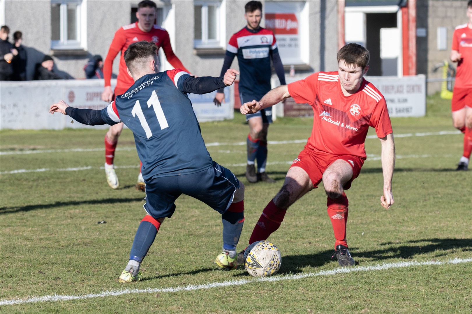 Turriff's Reece McKeown getting past Lossie's Ross Paterson. ..Lossiemouth F.C. v Turriff United F.C. at Grant Park...Picture: Beth Taylor.