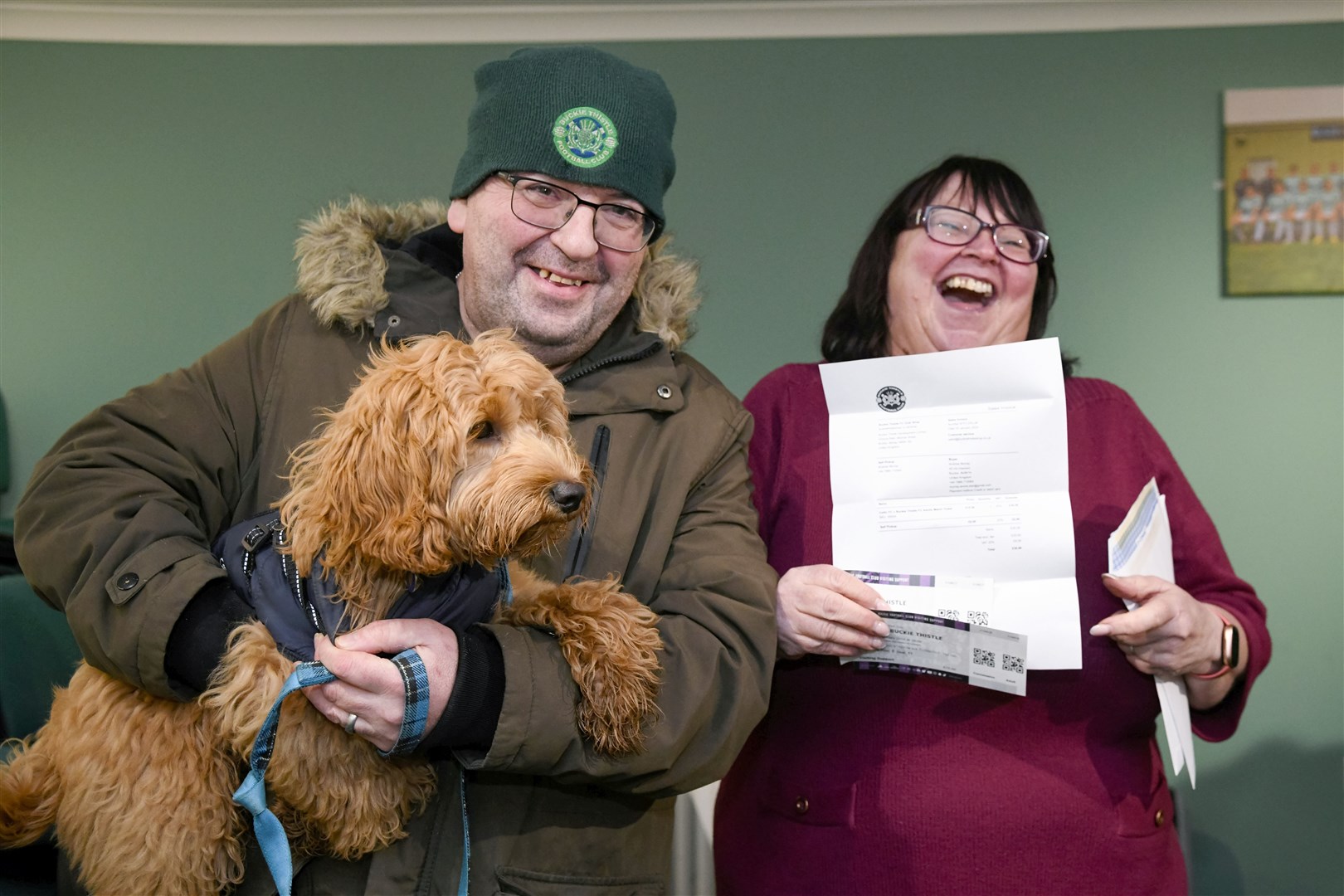 Andrew and Amanda Murray with Hector and their Celtic v Buckie Thistle cup tie tickets...Picture: Beth Taylor.