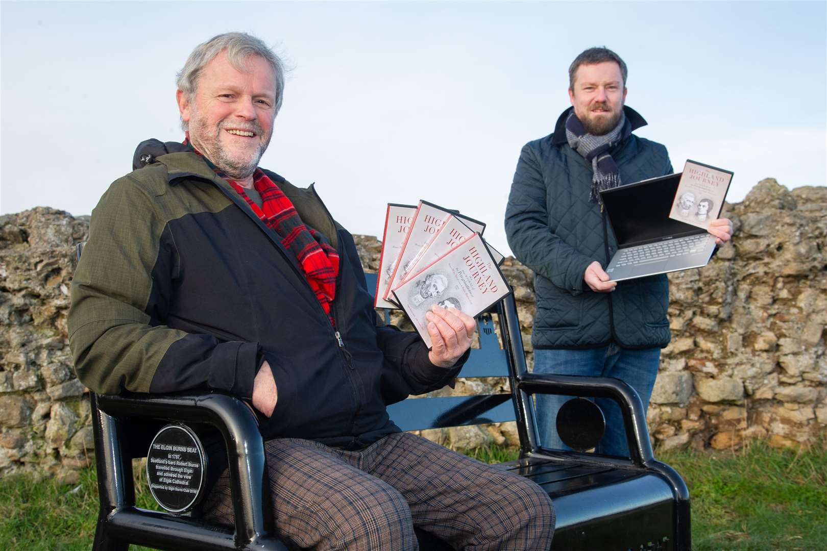 Elgin Burns Club's Neil Urquhart (Secretary) and Donald Lunan (President) with the DVD the club has produced ahead of their virtual Burns Supper on the 25th of January...Picture: Daniel Forsyth..