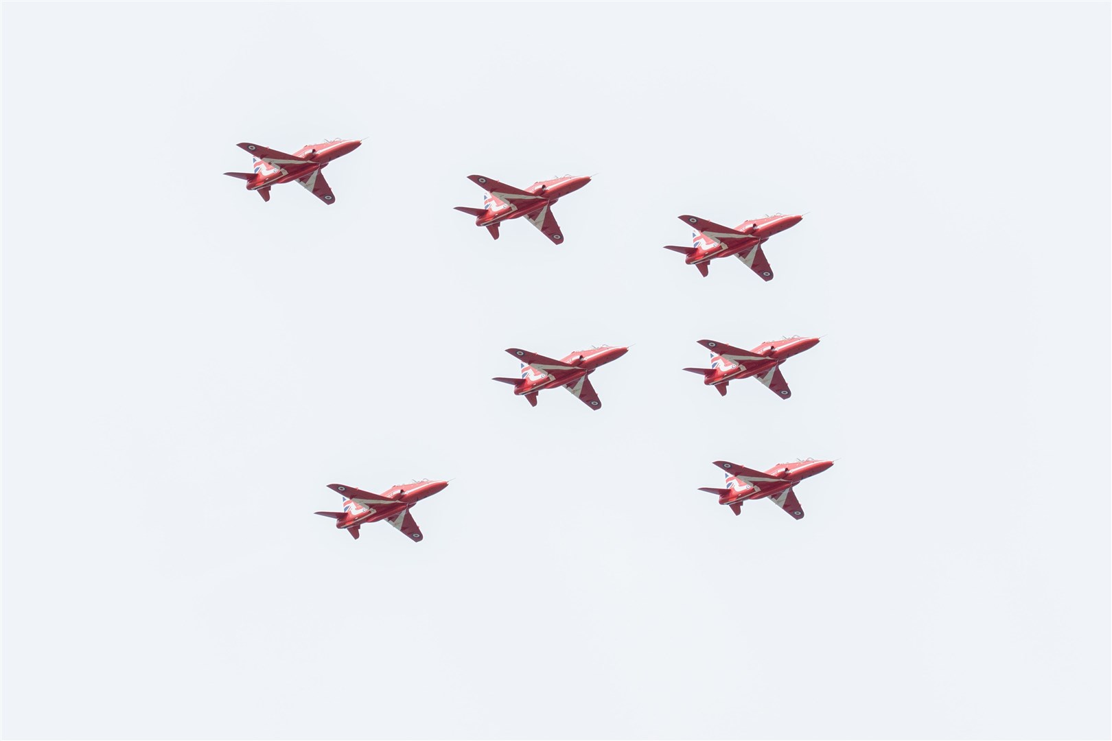 The Red Arrow Display team fly over Lossiemouth as part of the RAF Lossiemouth Family and Friend's Day...Picture: Daniel Forsyth..