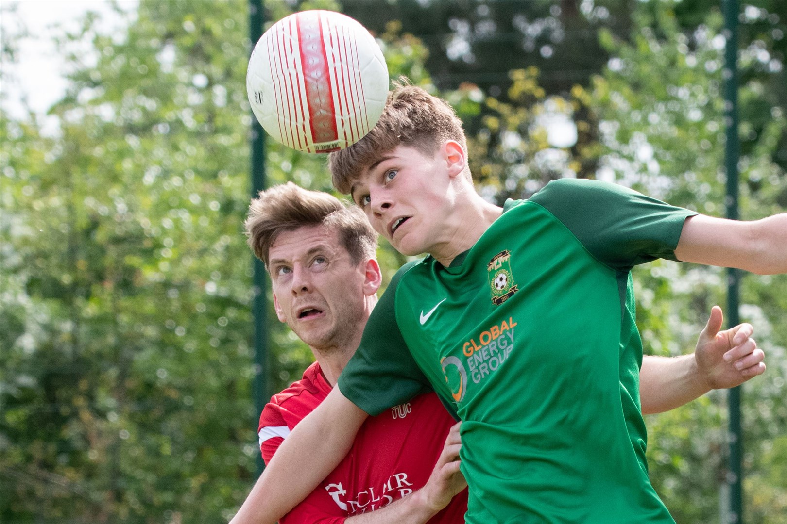 Forres' Neil Moir and Dufftown's Aiden Cruickshank compete for the ball...Dufftown FC (2) vs Forres Thistle FC (2) - Dufftown FC win 5-3 on penalties - Elginshire Cup Final held at Logie Park, Forres 14/05/2022...Picture: Daniel Forsyth..