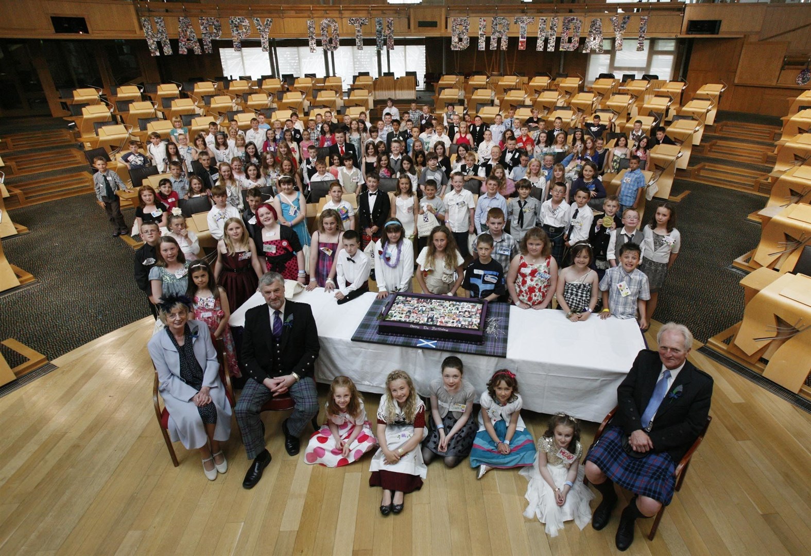 Presiding Officer Alex Fergusson and Deputy Presiding Officers Trish Godman and Alasdair Morgan are pictured with the 1st July babies who came to the Parliament to share the 10th Birthday celebrations in 2009. Picture: Adam Elder/Scottish Parliament