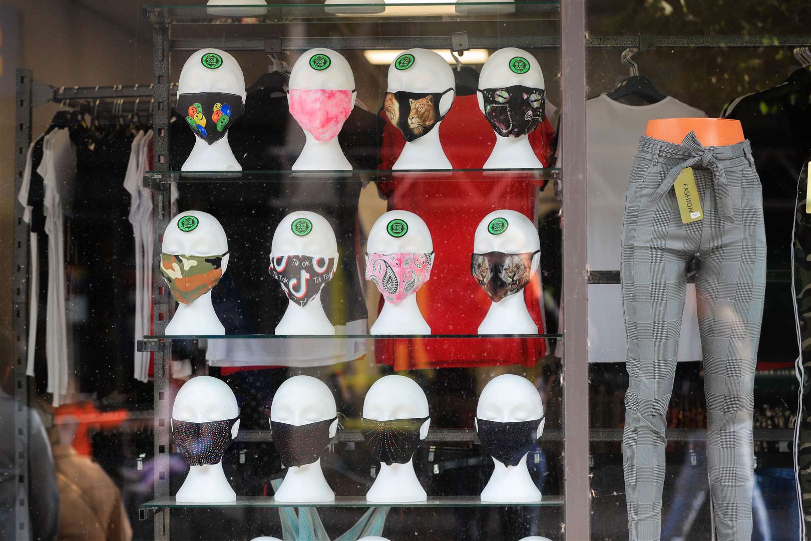 Assorted colourful face coverings for sale in a shop window in Nottingham city centre (Mike Egerton/PA)