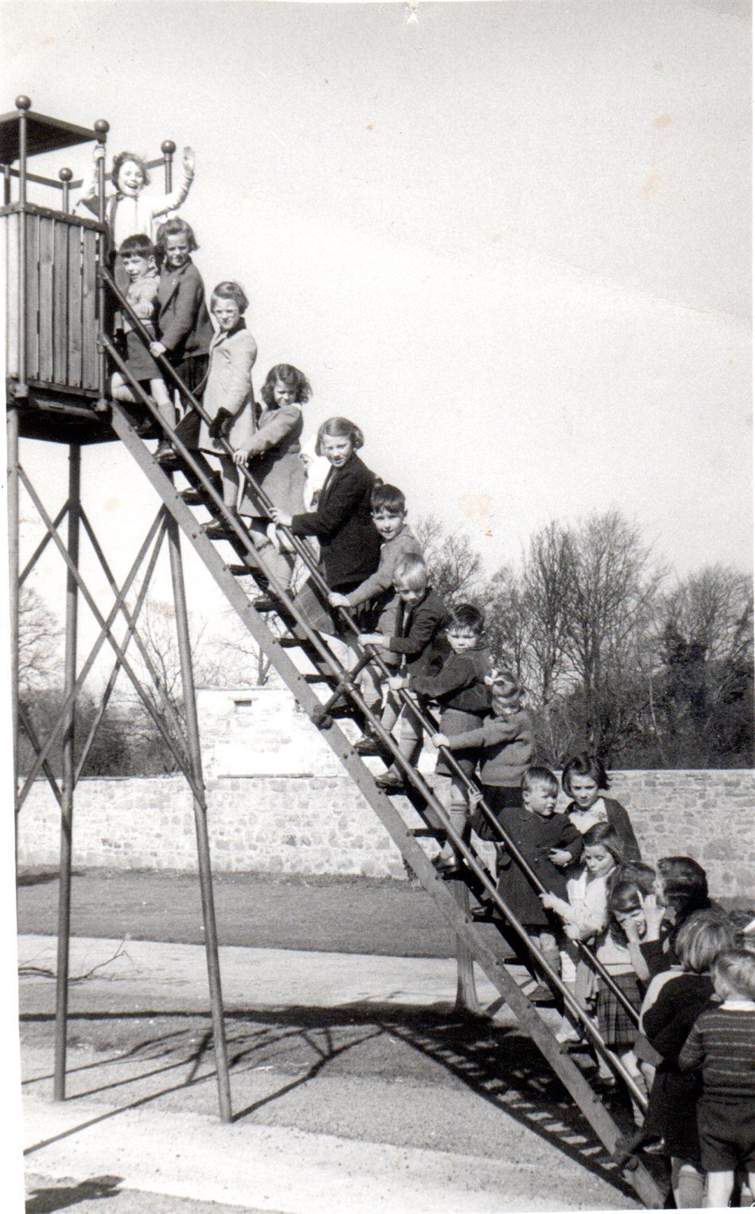 Children queue for their turn during a day at Elgin's Cooper Park in this old photograph, taken around 1955.