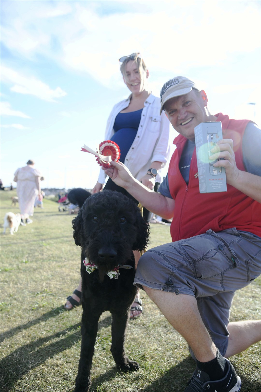 Claire MacLeay and her dog Otto who won the large dog catergory and the best in show along with the sponsor, Stuart Mason, from Pawbags. Picture: Beth Taylor