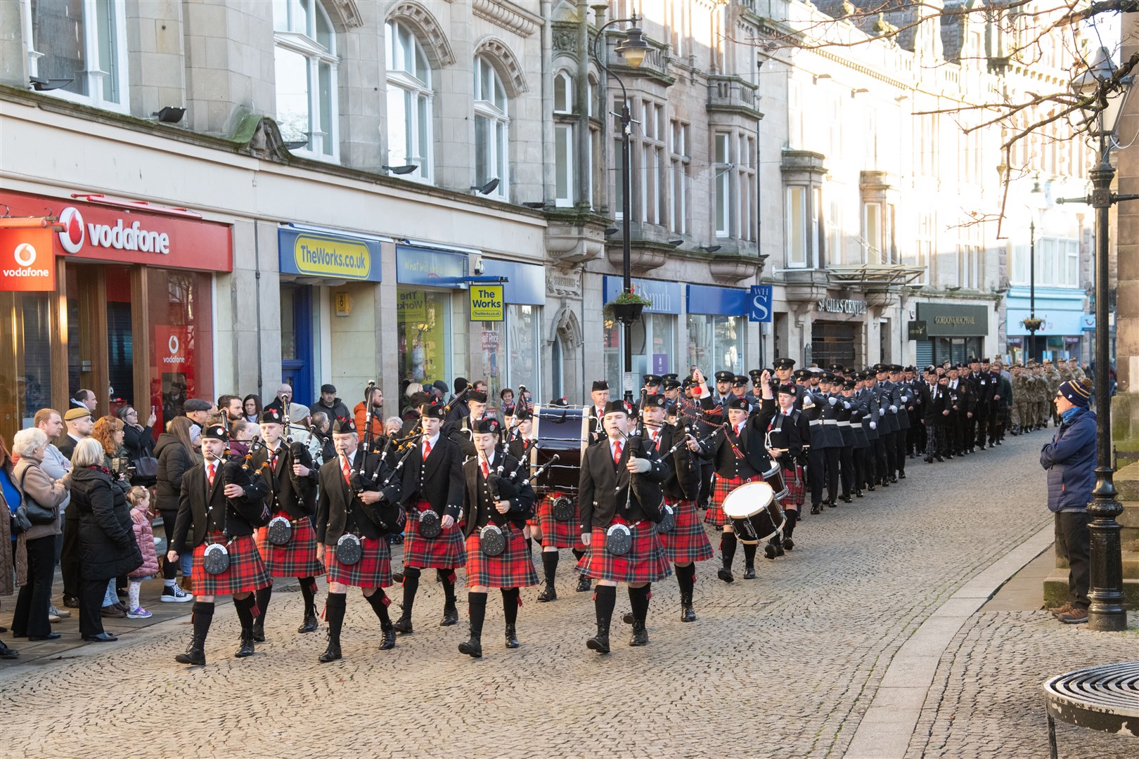 The Elgin and District Pipe Band lead the parade...Remembrance Sunday parade and wreath laying on Elgin High Street 2023. ..Picture: Daniel Forsyth..