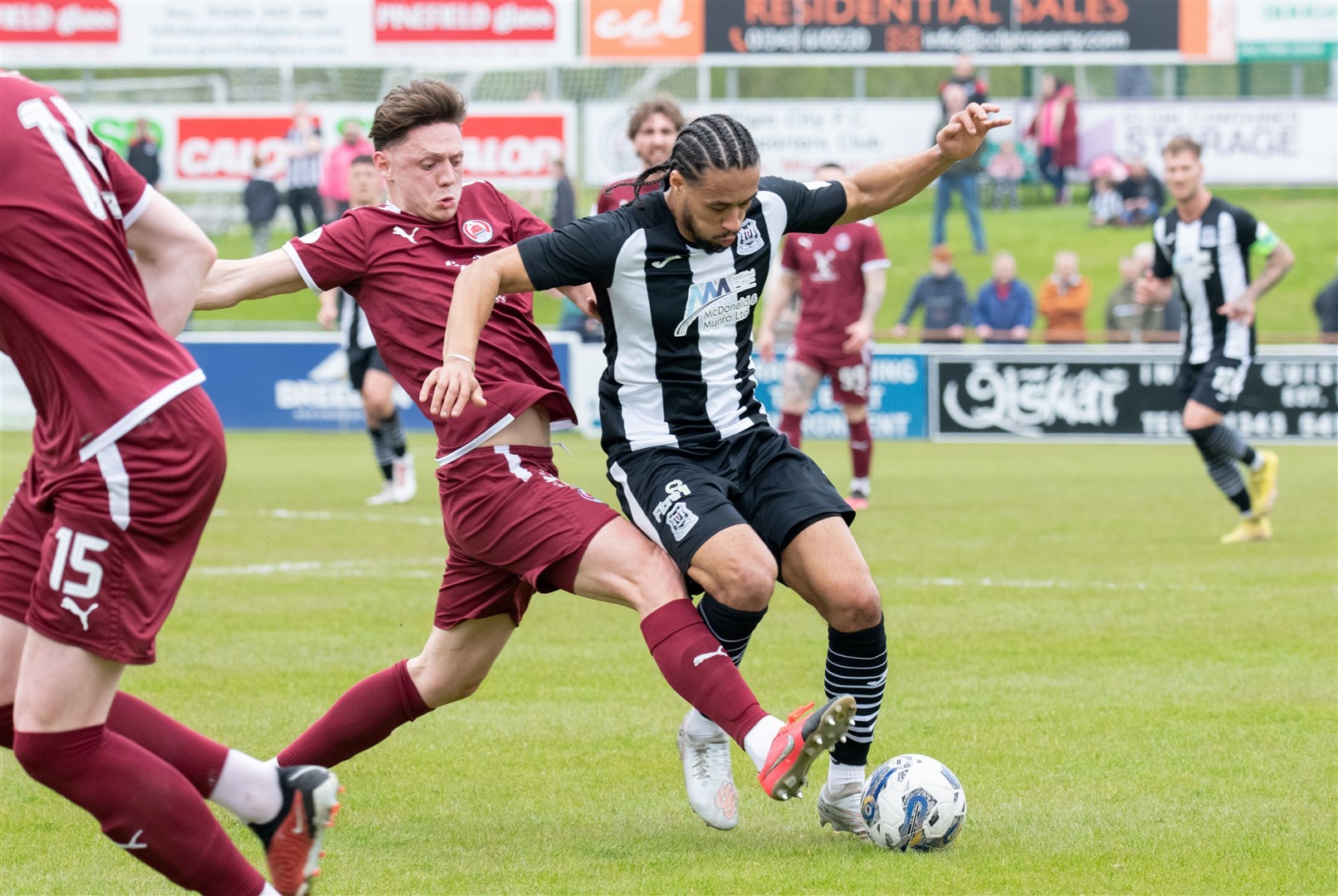 Clyde's Craig Howie goes in for a challenge on Elgin City's Dayshonne Golding. Elgin City FC (0) vs Clyde FC (3) - Scottish League Two 23/24 - Borough Briggs, Elgin 4/5/2024.Picture: Daniel Forsyth.
