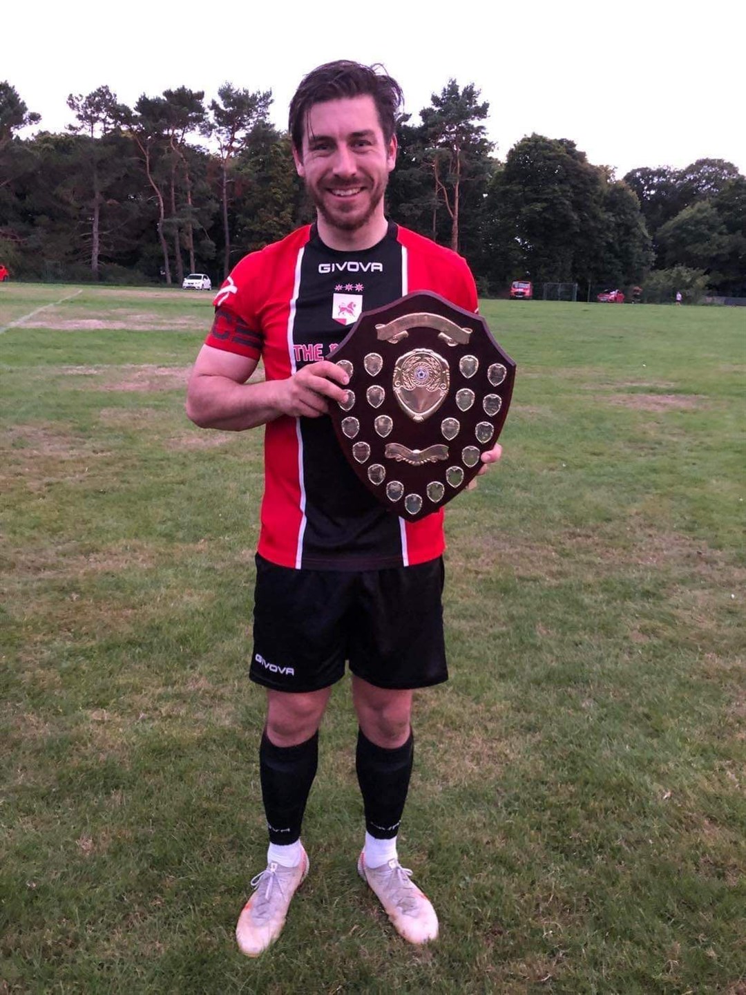 Captain Ben Stewart gets his hands on the Abbeyside shield.