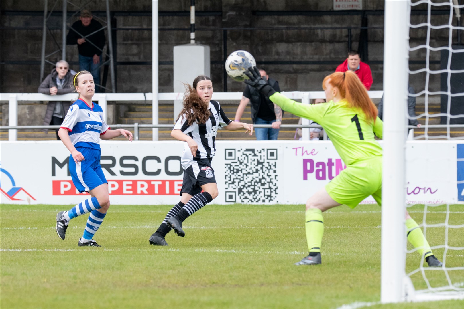 Elgin City's Orla Scott forces a good save from Dyce keeper Faith Jessica Maan.Elgin City Women (5) vs Dyce Women FC (5) - SWFL North 2023/24 - Borough Briggs, Elgin 5/5/2024.Picture: Daniel Forsyth.