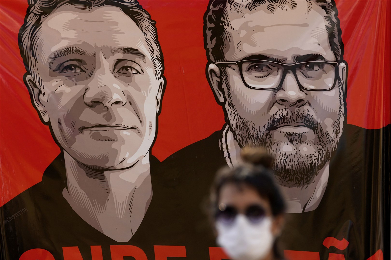 A banner with images of Mr Pereira, right, and Mr Phillips, during a vigil in Brasilia (Eraldo Peres/AP)