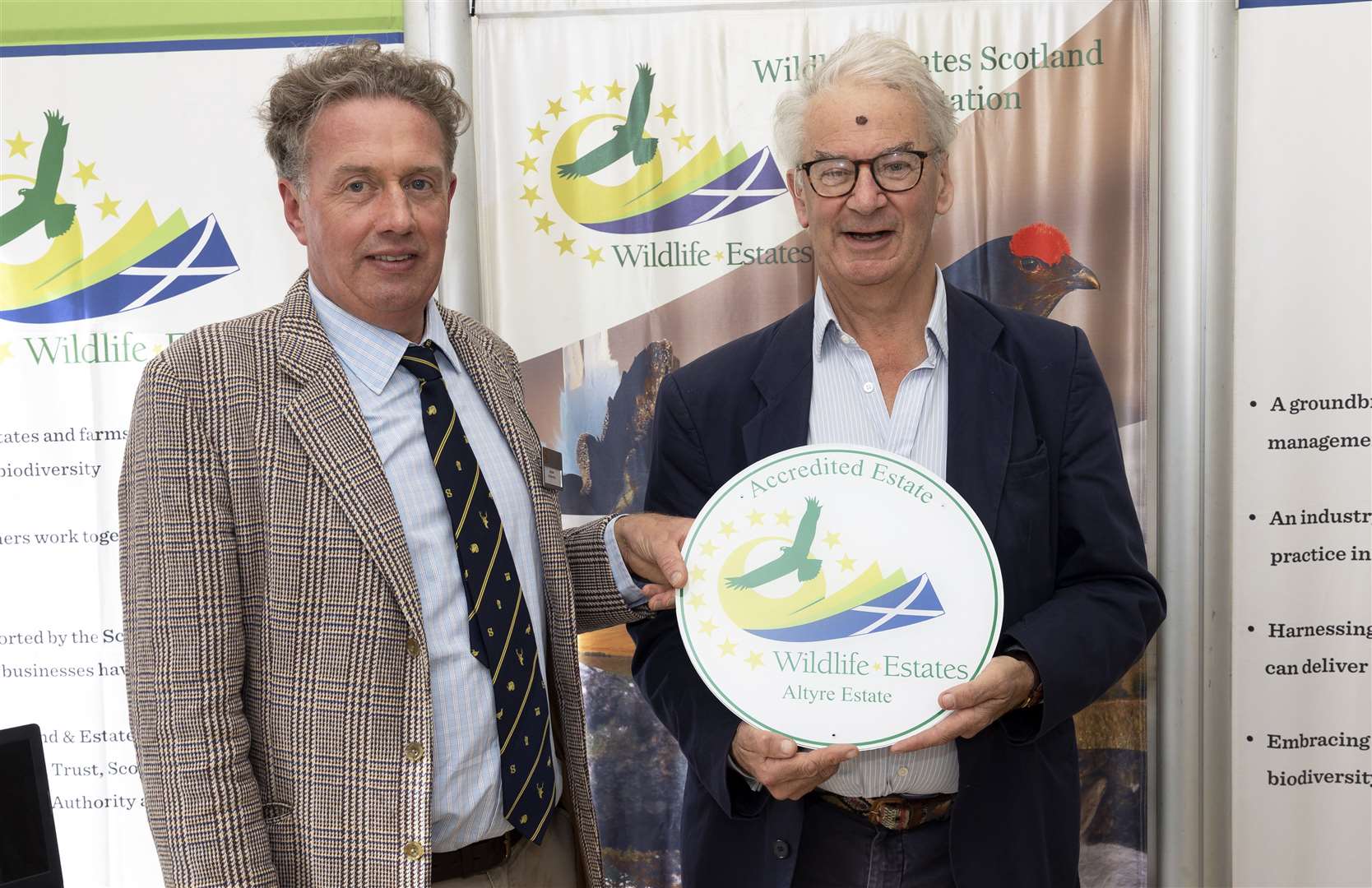 Sir Alastair Gordon Cumming, of Altyre Estate, receives a Wildlife Estates Scotland Accreditation Award from Dee Ward, of Scottish Land and Estates. Picture: Graeme Hart.