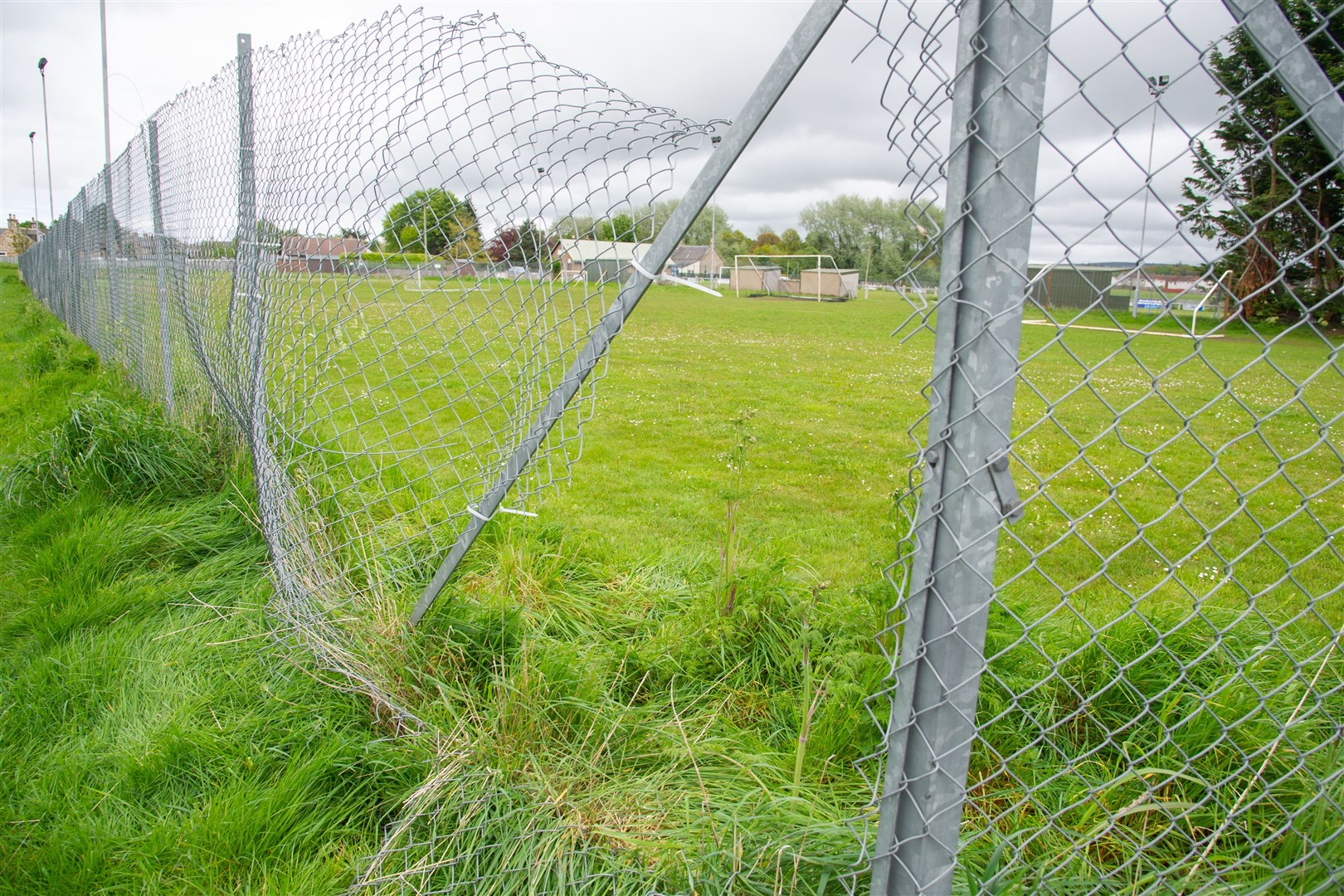 A hole is still visable, although the club have made temporary repairs on some of the fence...The perimeter fence at Logie Park, home of Forres Thistle, has been vandalised...Picture: Daniel Forsyth..