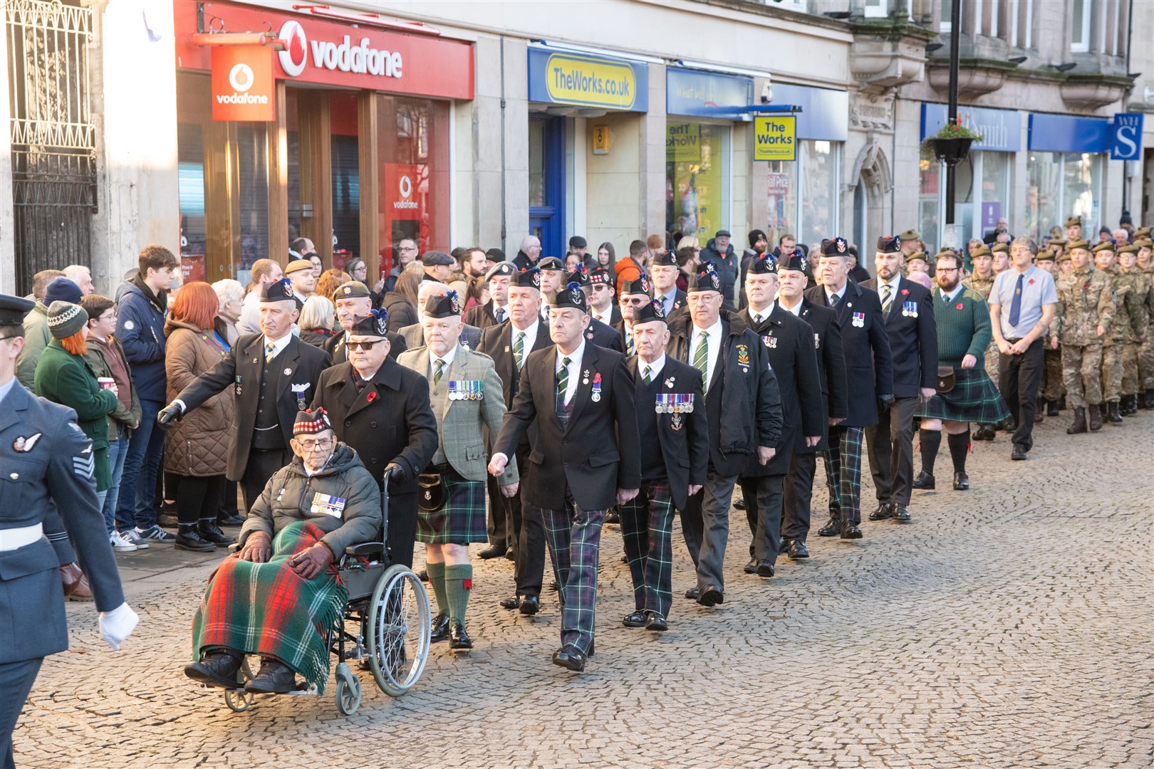 War veterans march down Elgin High Street as part of the Remembrance Sunday parade...Remembrance Sunday parade and wreath laying on Elgin High Street 2023. ..Picture: Daniel Forsyth..