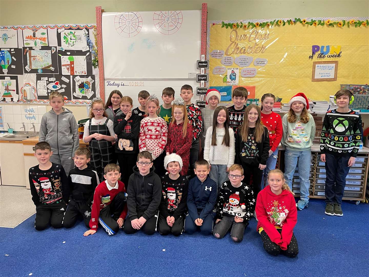 Posing for a party picture are P6/7L.