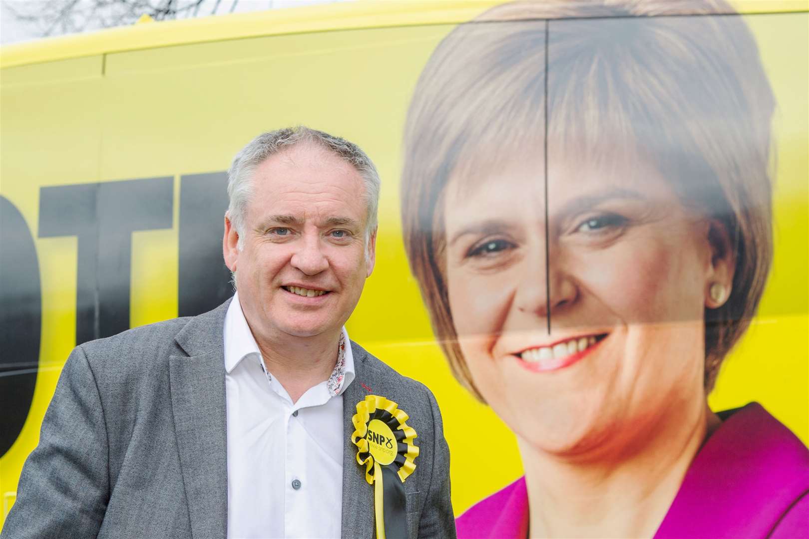 Moray SNP candidate Richard Lochhead alongside a photo of the First Minister Nicola Sturgeon on the SNP Campaign Bus at Keith...Picture: Daniel Forsyth..