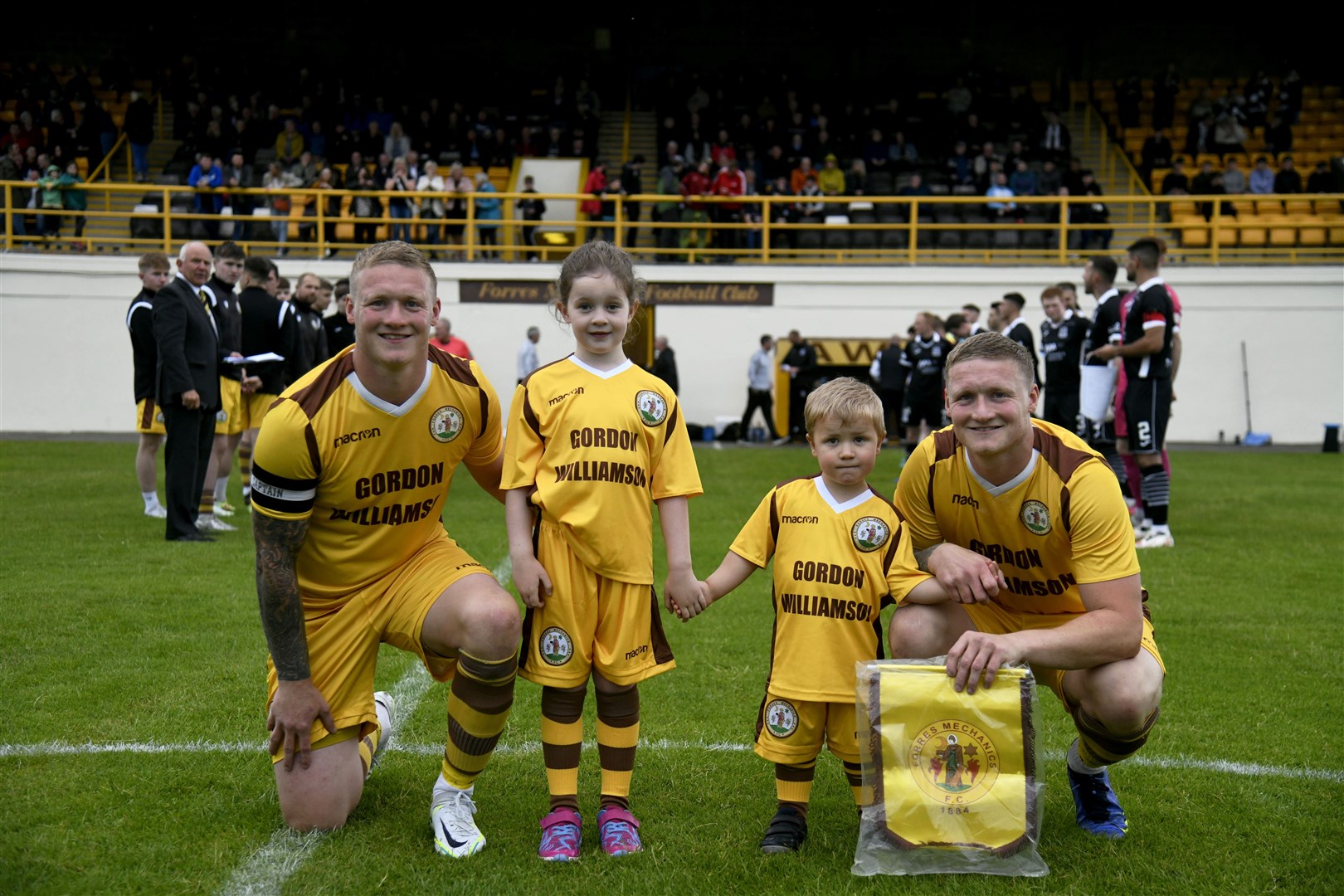 Lee (left) and Graham Fraser with mascots Eilidh and Harris Norman. Picture: Beth Taylor...