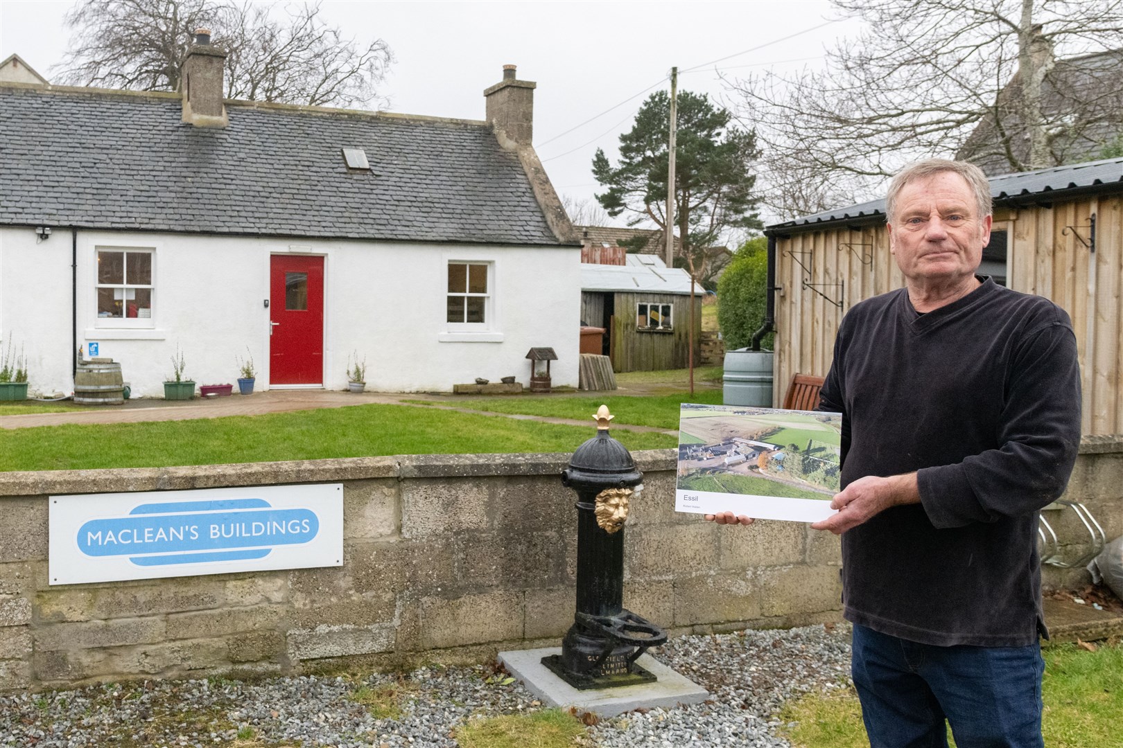 Garmouth's Rob Wallen outside the village's community hub with his book 'Essil'. Picture: Beth Taylor.