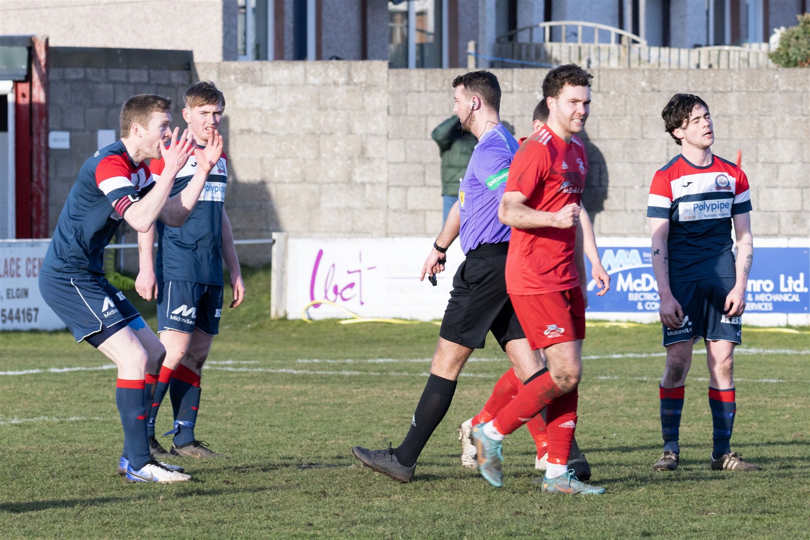 Referee, David Alexander, pointing to the penatly spot for Lossie. ..Lossiemouth F.C. v Turriff United F.C. at Grant Park...Picture: Beth Taylor.
