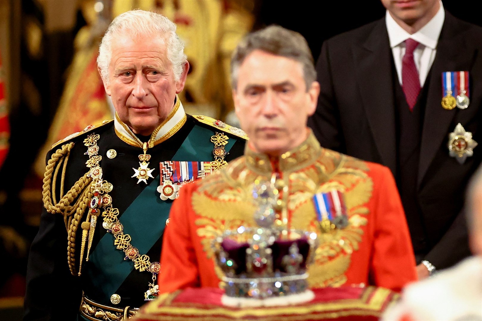 The Prince of Wales processes behind the Imperial State Crown through the Royal Gallery (Hannah McKay/PA)