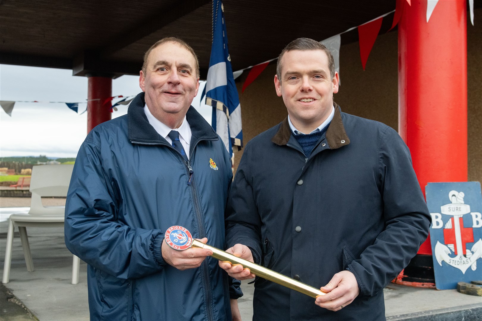 James Allan (Lossiemouth) and Douglas Ross holding the King's Baton. Picture: Beth Taylor