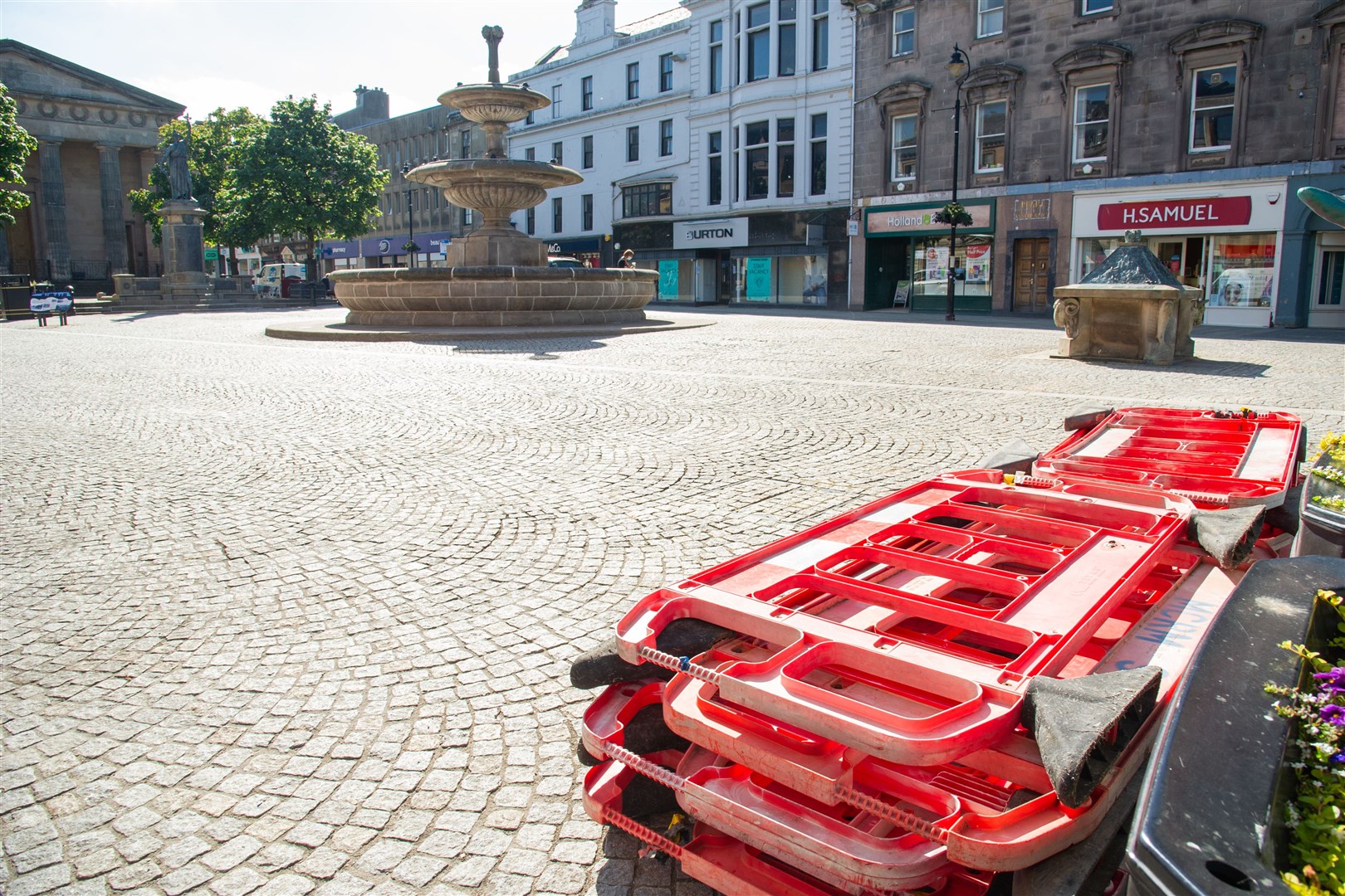 Wooden seating and planting beds have been removed from Elgin High Street, near the Trespass and Poundland stores. Picture: Daniel Forsyth.