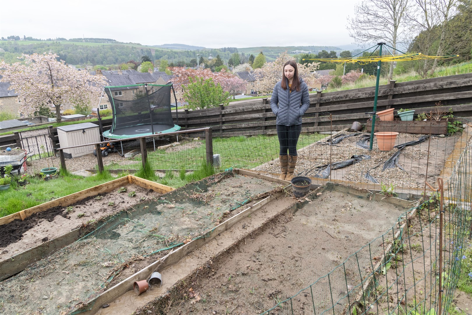 Amy Tait looking at what was her vegetable patch now destroyed by the floods in Aberlour...Picture: Beth Taylor.