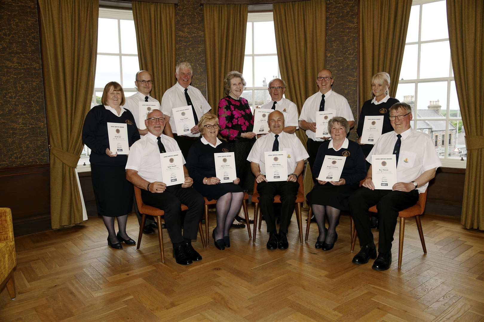 Buckie BB officers and helpers proudly show off their long service awards. Picture: Eric Cormack