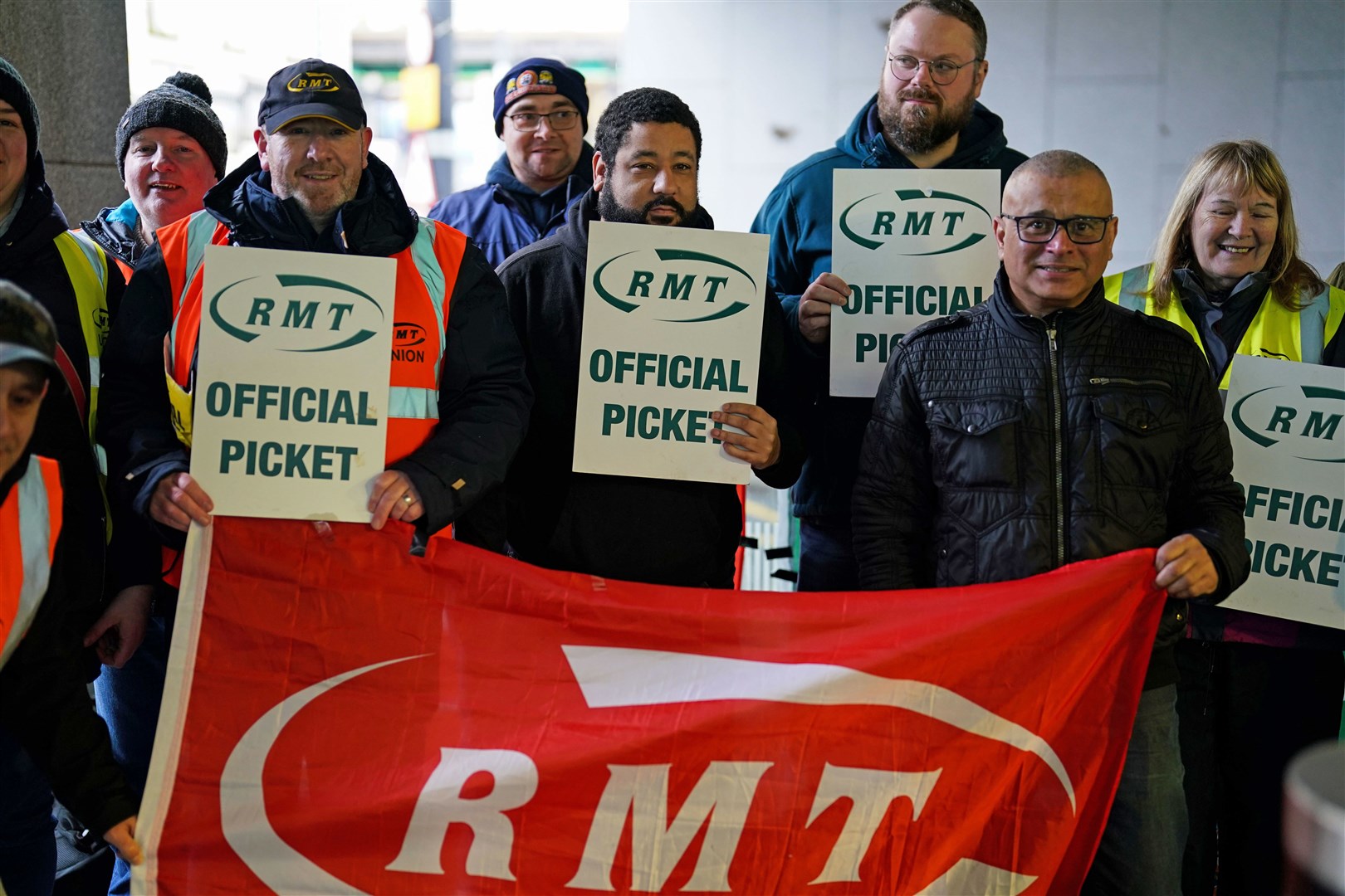 Members of the Rail, Maritime and Transport union (RMT) on the picket line outside New Street station in Birmingham during a rail strike in a long-running dispute over jobs and pensions. P(Jacob King/PA)