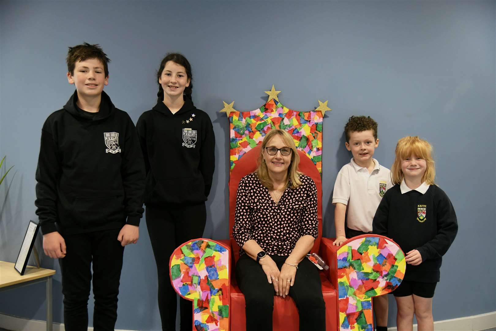 Keith Primary classroom assistant, Hilary Reid on her last day with P7's Quentin Barclay (far left), Aimee McCray (right) and P1's Alfie Cruickshank (right) and Katie Webster (far left). Picture: Beth Taylor