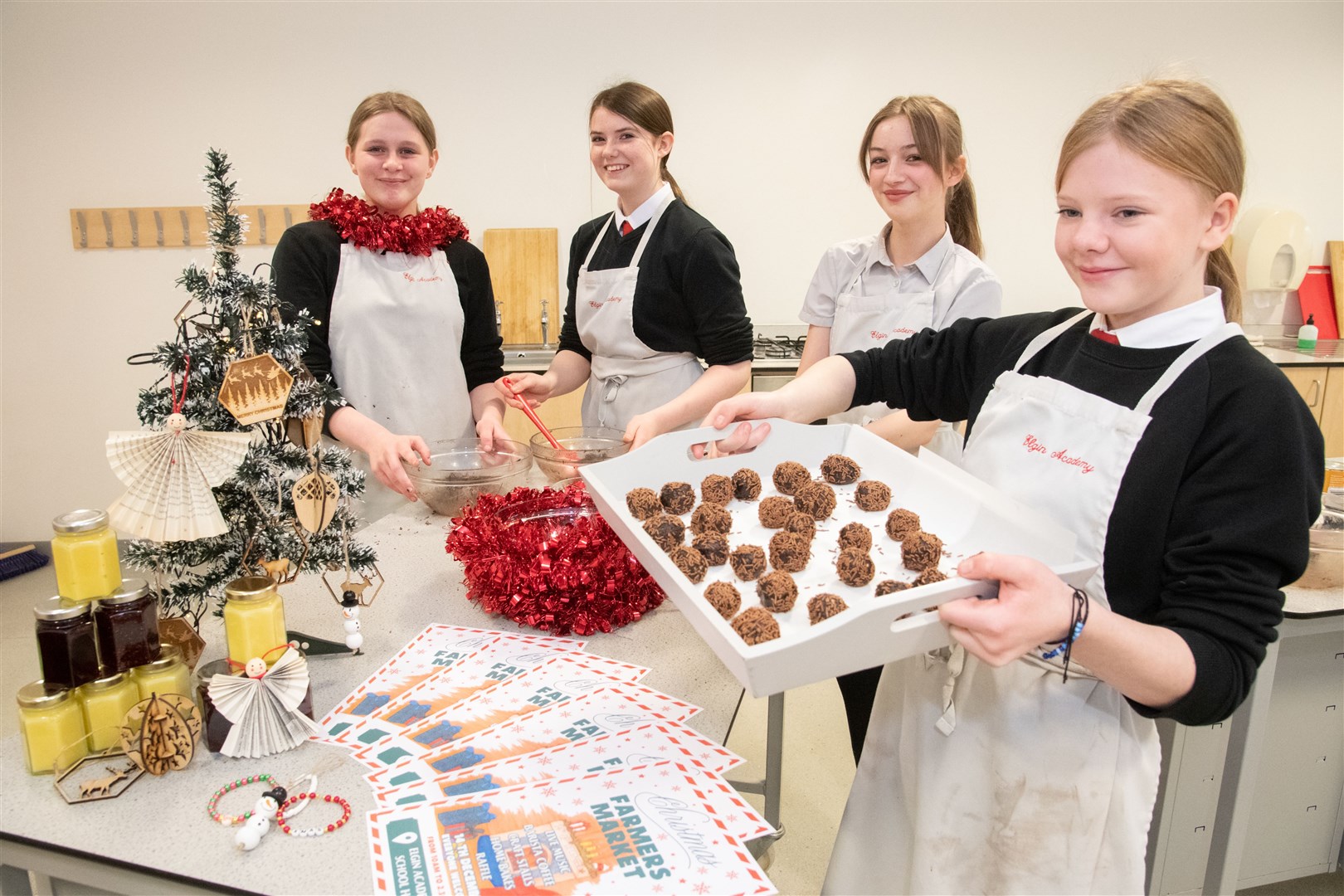 From left; Maddison Marshall, Mable Spencer, Erin Langdale and Freya Main. ..Preparation continue ahead of the Elgin Academy Christmas Market, which will take place on Thursday December 14th...Picture: Daniel Forsyth..