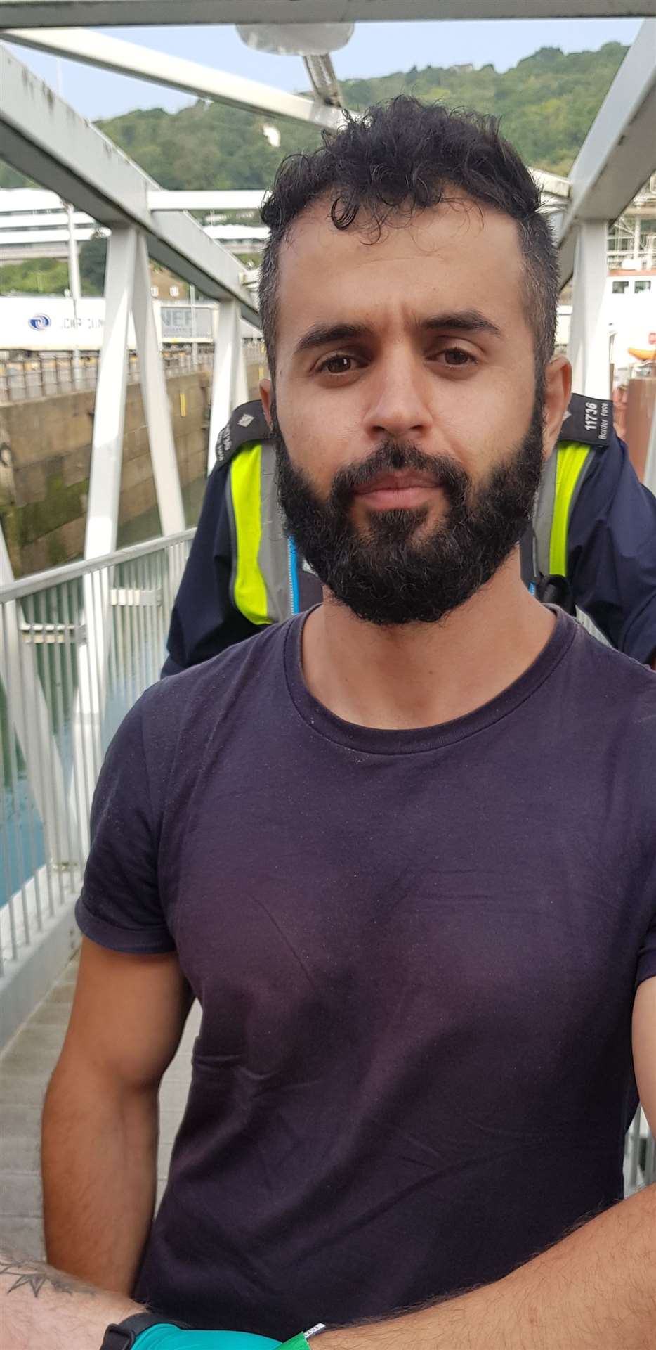 Fouad Kakaei, 30, a migrant fleeing persecution in Iran, disembarking at Dover (Home OFfice/PA)