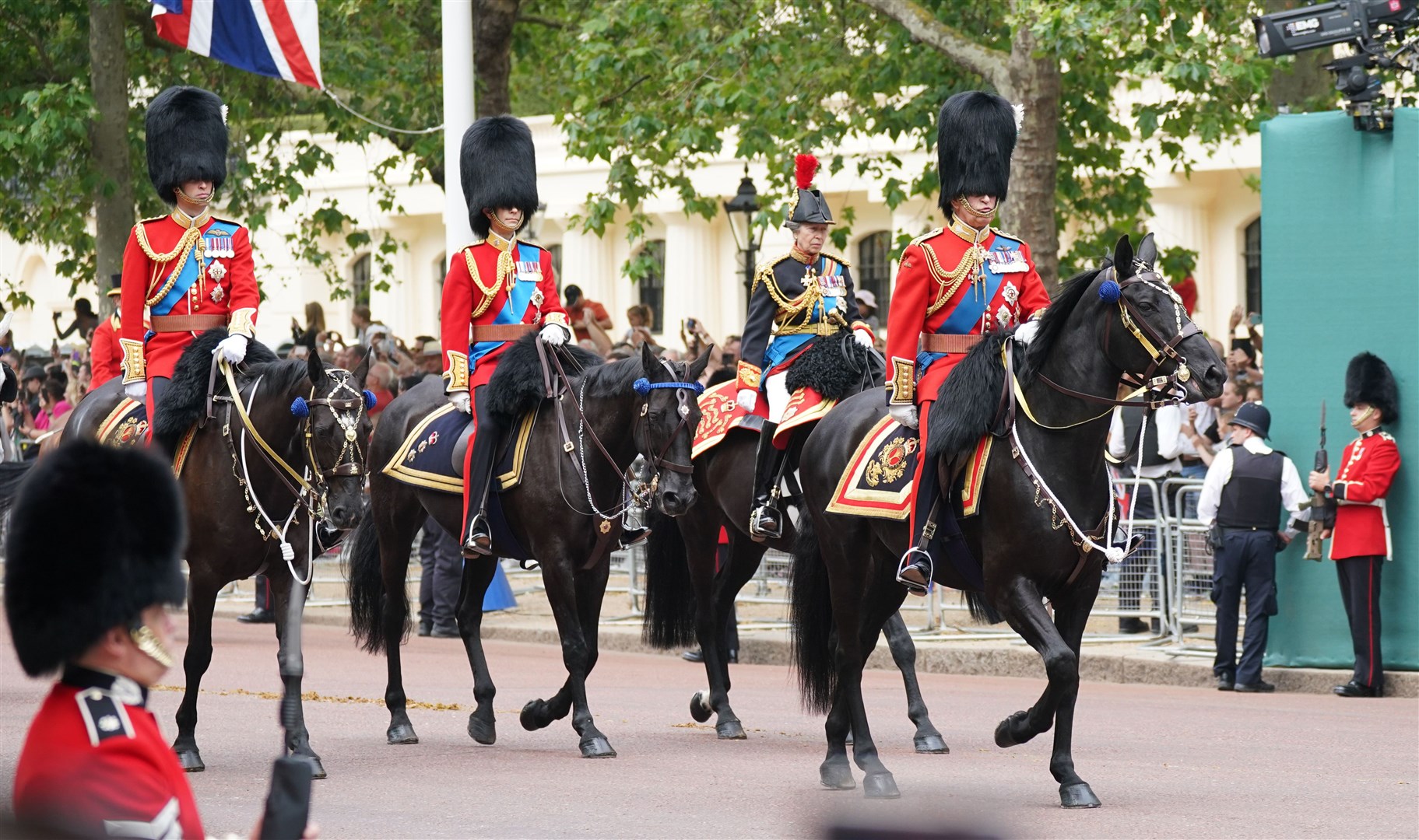The King leads, from left, the Prince of Wales, the Duke of Edinburgh and the Princess Royal down The Mall (Yui Mok/PA)