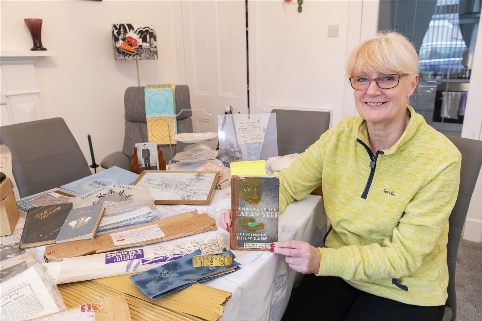 Hazel Grant is putting on a display at Burghead Community Hall of all the memorabilia gained by a Burghead family throughout the years...Picture: Beth Taylor.