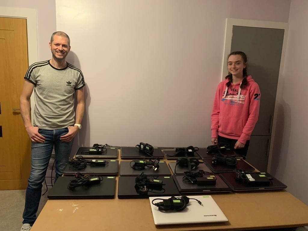 Steven Dunbar with his daughter Katie and the laptops they worked on.