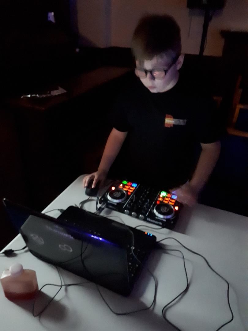 Lewis at his decks entertaining the crowd at his charity birthday disco.