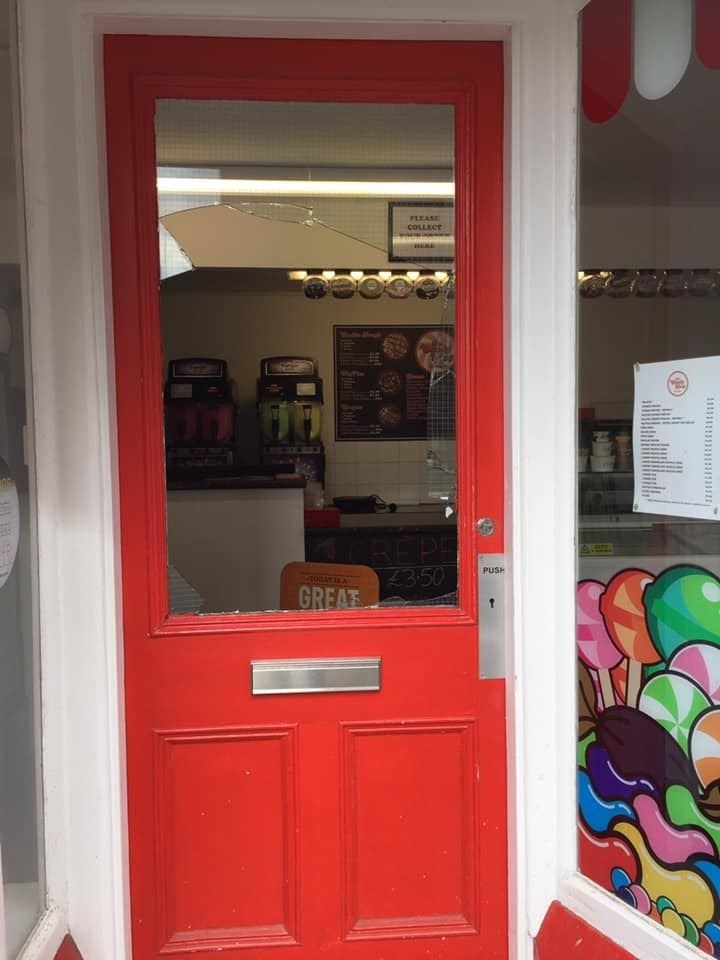 The front door of the Candy Shop in Elgin afte the break-in.