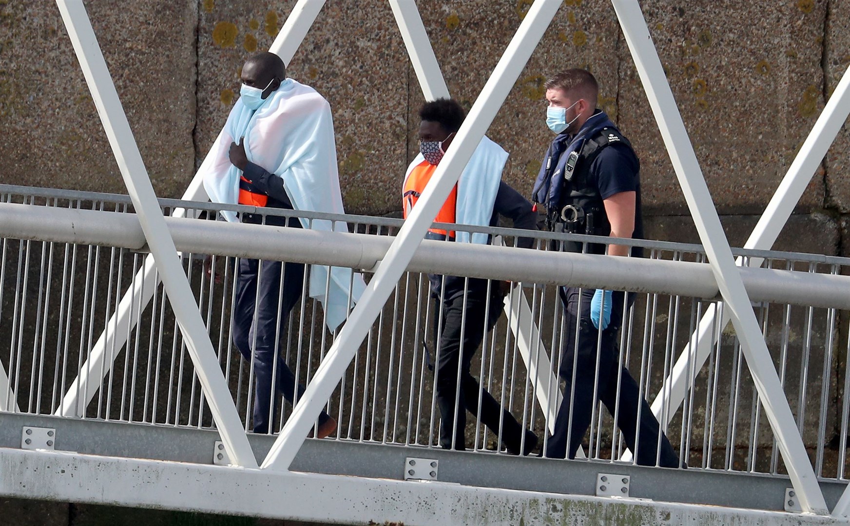 Two people thought to be migrants are brought into Dover (Gareth Fuller/PA)