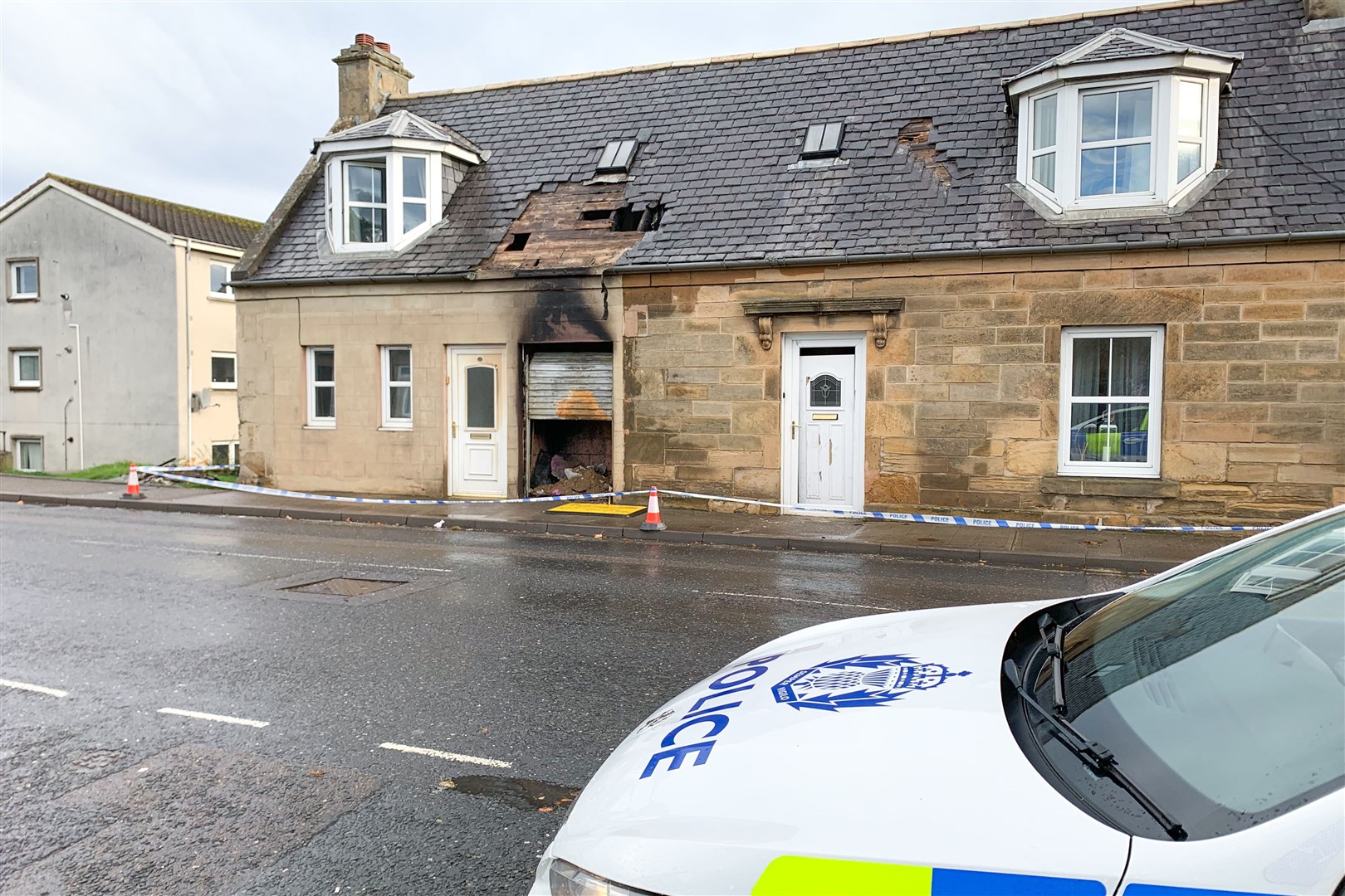 Police remain on the scene at a property fire on North Street in Bishopmill, Elgin...Picture: Daniel Forsyth..
