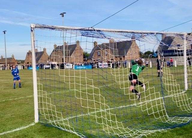 Lee Herbert saves Golspie's final kick in the shoot-out. Photo: George Rutherford