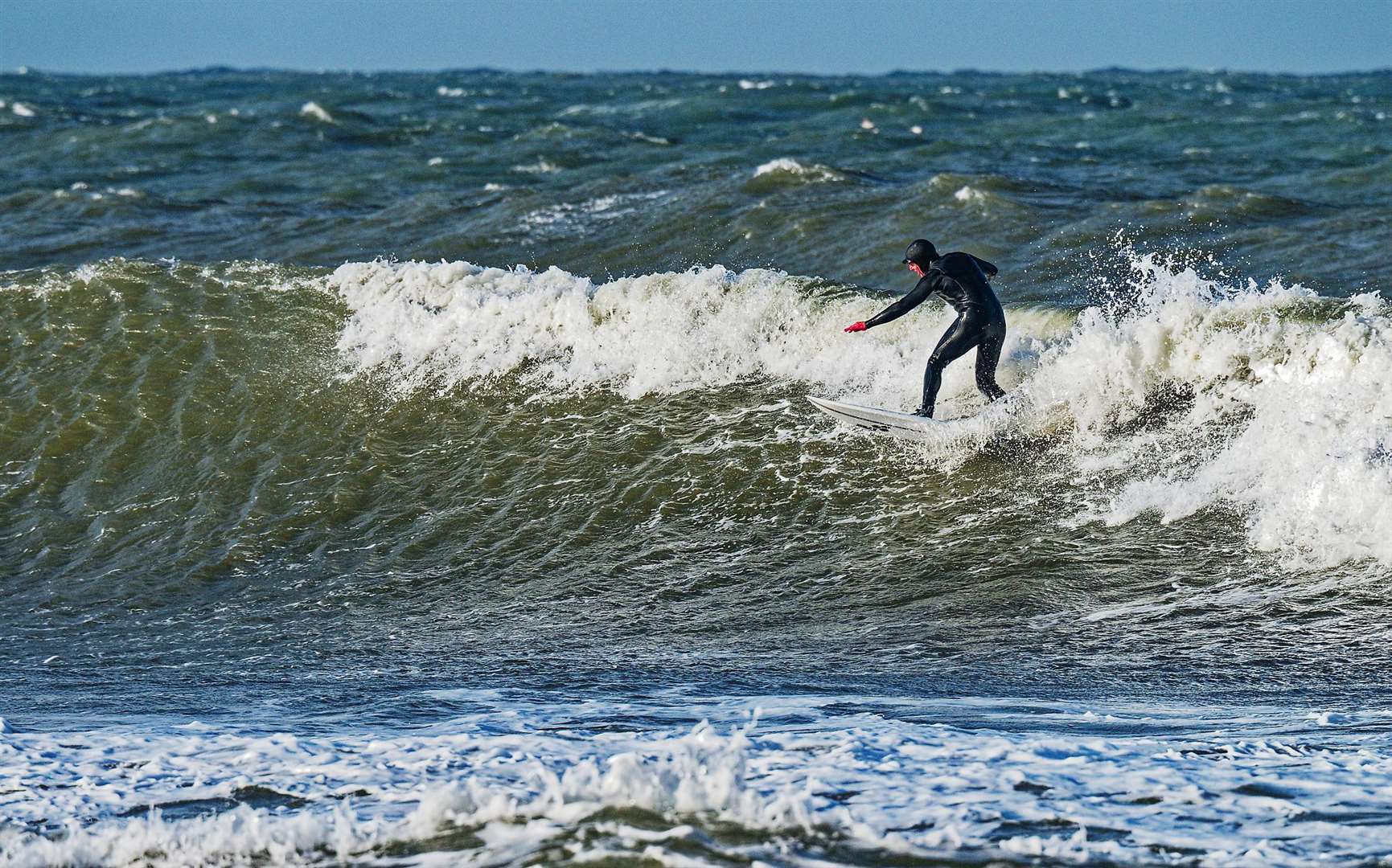 Riding the waves. Picture: Mike Sutherland