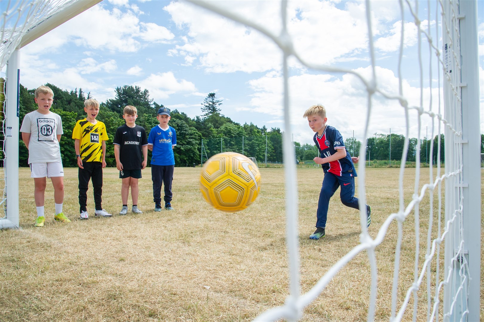 Mitchell Grant takes a shot at goal watched on by Mackie Stewart, Louie Buchan, Louie Buchan and Tyler McCabe...New football goals have been put up at Thornhill Playing Field in New Elgin after a fundraising campaign raised Â£4,000 for the cause. ..Picture: Daniel Forsyth..