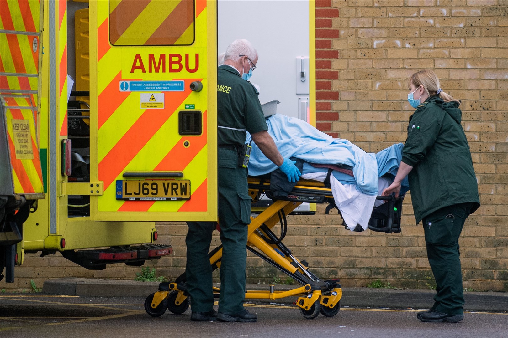 Paramedics transfer a patient from an ambulance at Southend University Hospital in Essex (Joe Giddens/PA)