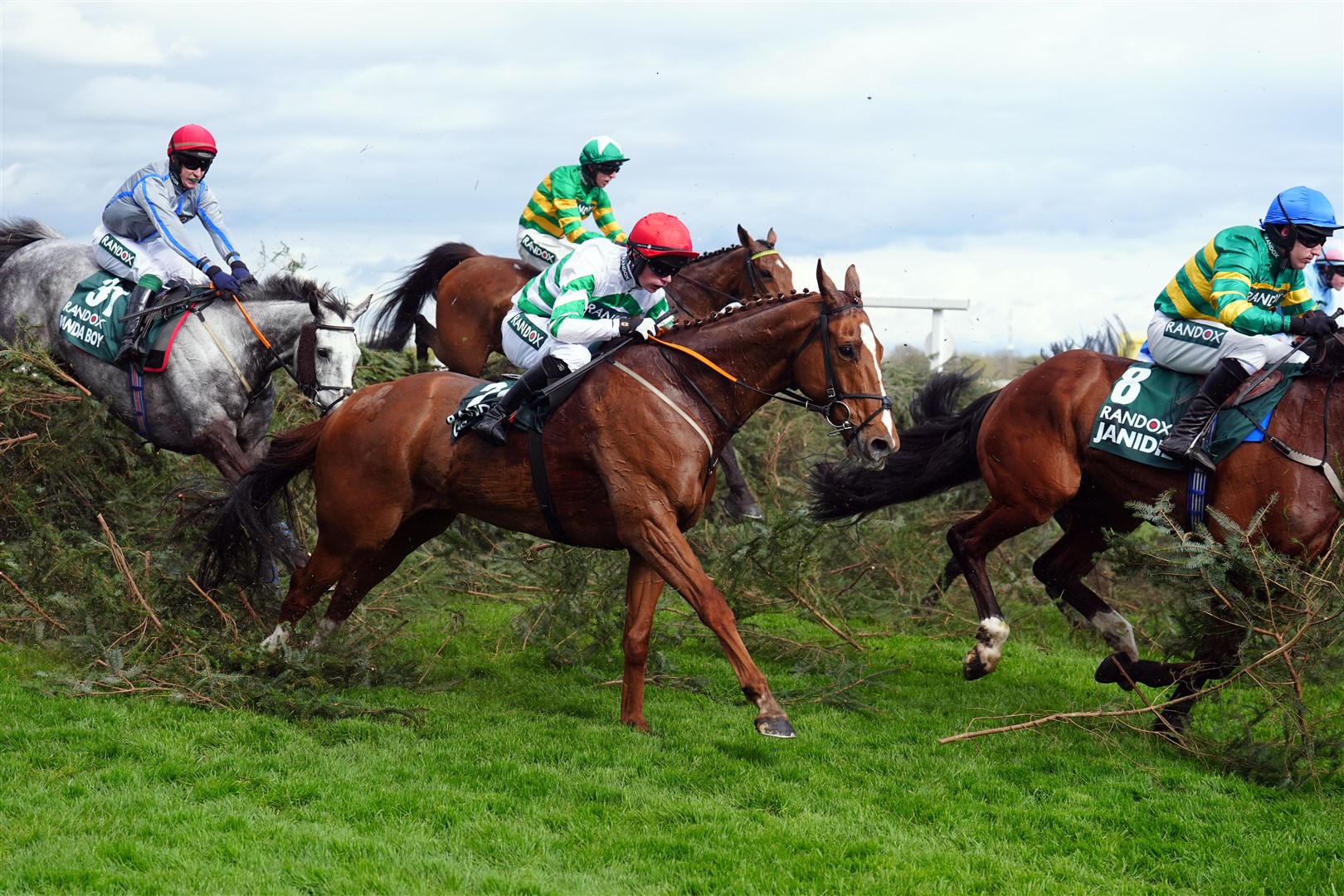 Runners and riders jump the Chair during the Randox Grand National Handicap Chase (Mike Egerton/PA)