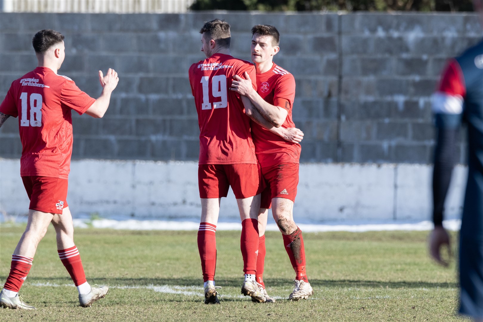 Lossie's Ross Morrison (centre) and Niall Kennedy (left) celebrating Liam Archibald's goal. ..Lossiemouth F.C. v Turriff United F.C. at Grant Park...Picture: Beth Taylor.