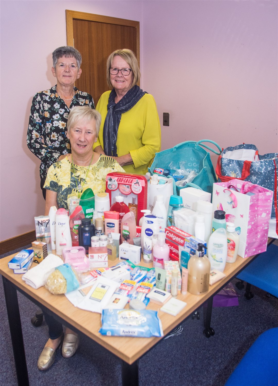 Elgin Ball group which meets in the town hall every Wednesday from 10am to noon have donated toiletries to the appeal. Secretary Lorna Castle (front) and members Liz Russell (right) and Maureen Hyslop handed them over. Picture: Becky Saunderson.
