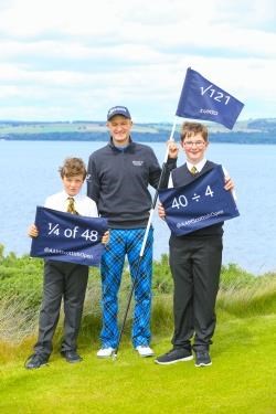 Ossian Maclellan (10) of Ardersier Primary and Harry Ratcliffe (12) of Balloch Primary are joined by Aberdeen Asset Management ambassador Russell Knox at Castle Stuart Golf Links ahead of the Aberdeen Asset Management Scottish Open