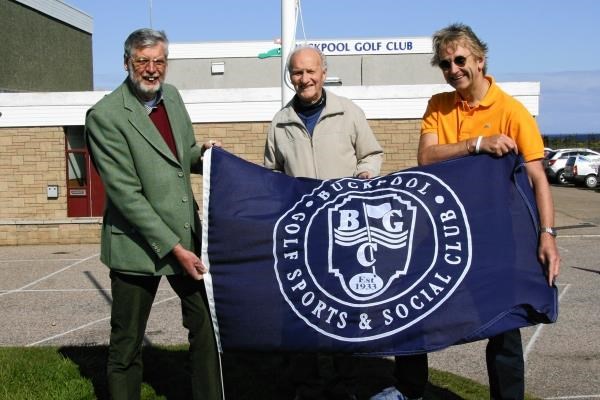 Flying the new flag at Buckpool Golf Sports and Social Club (from left) are John Adam (club secretary), Peter Cowie (honorary president) and Alex Smith (club captain).