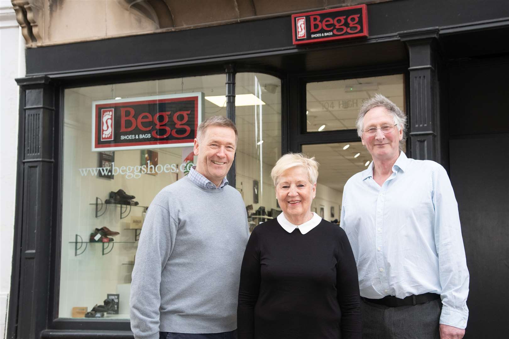 From left; Garek Begg, Annita Brown and Alan Reid...Long-serving members of staff are rewarded for their service at Elgin shop Begg's Shoes and Bags...Picture: Daniel Forsyth..